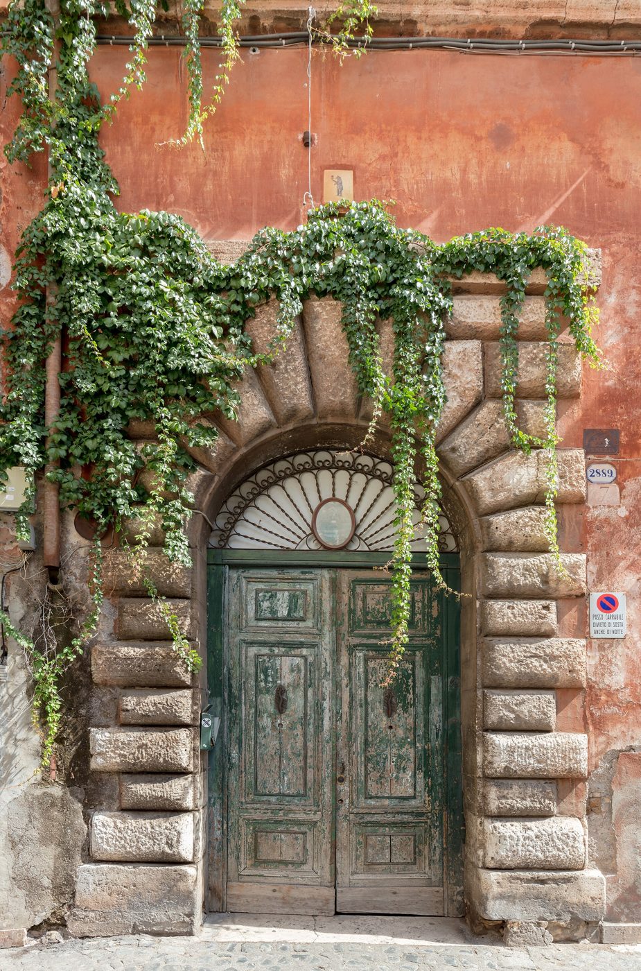 Ivy-framed doorway in Trastevere, Rome