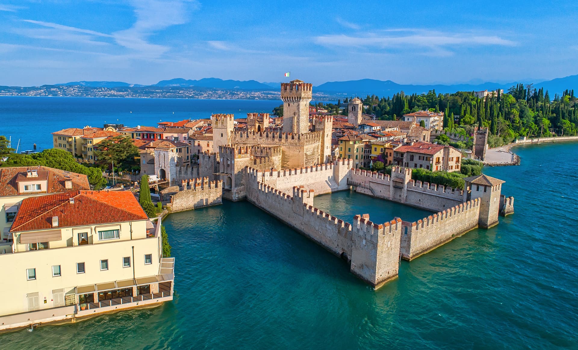The Scaligero castle in Sirmione, surrounded by the water of Lake Garda