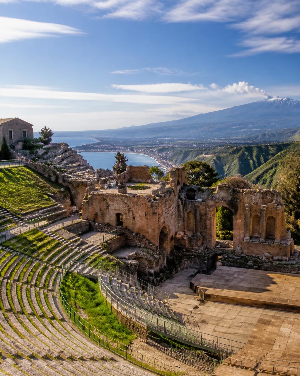 Ancient Greek theatre in Taormina with Etna