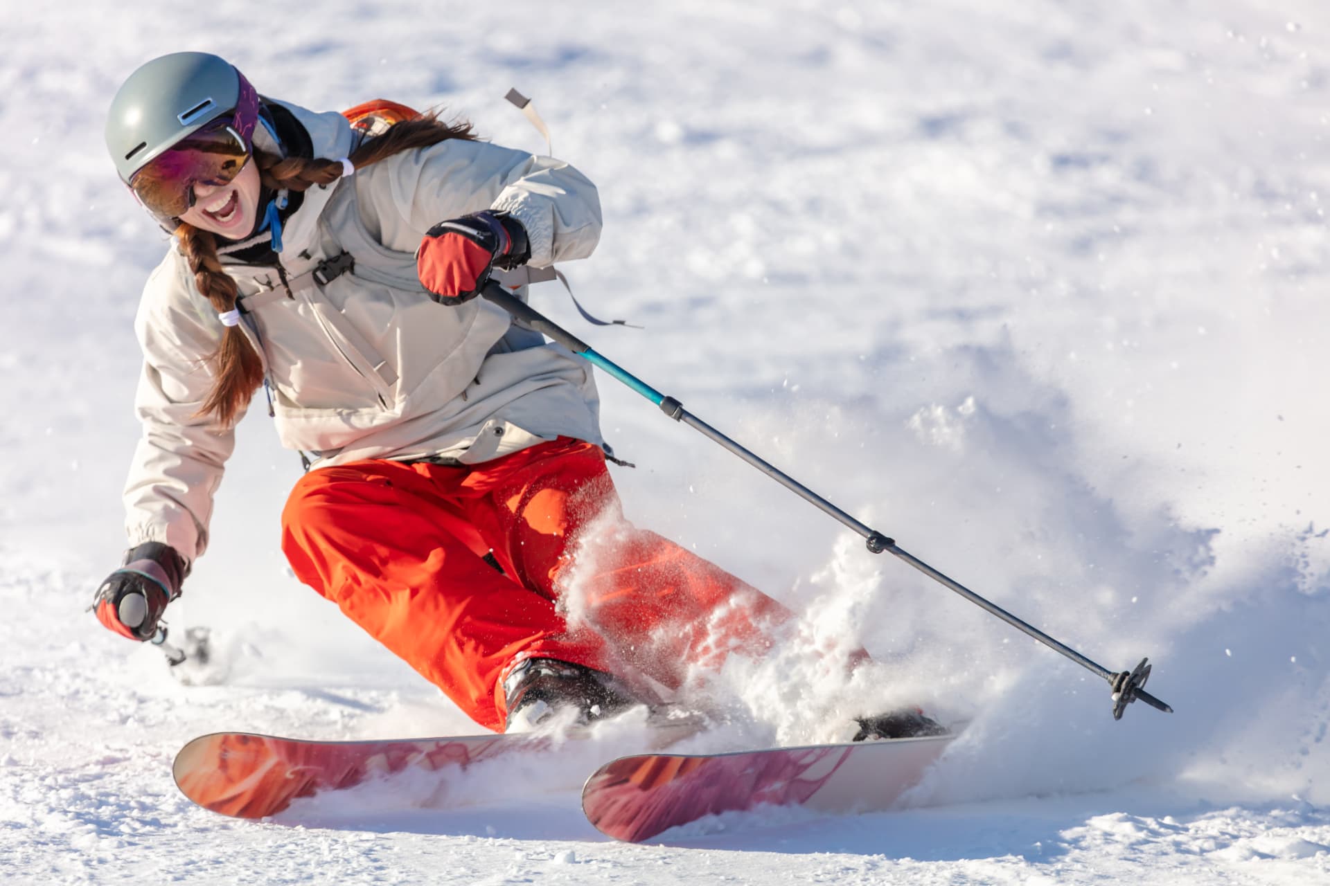 Skier carving through fresh powder snow